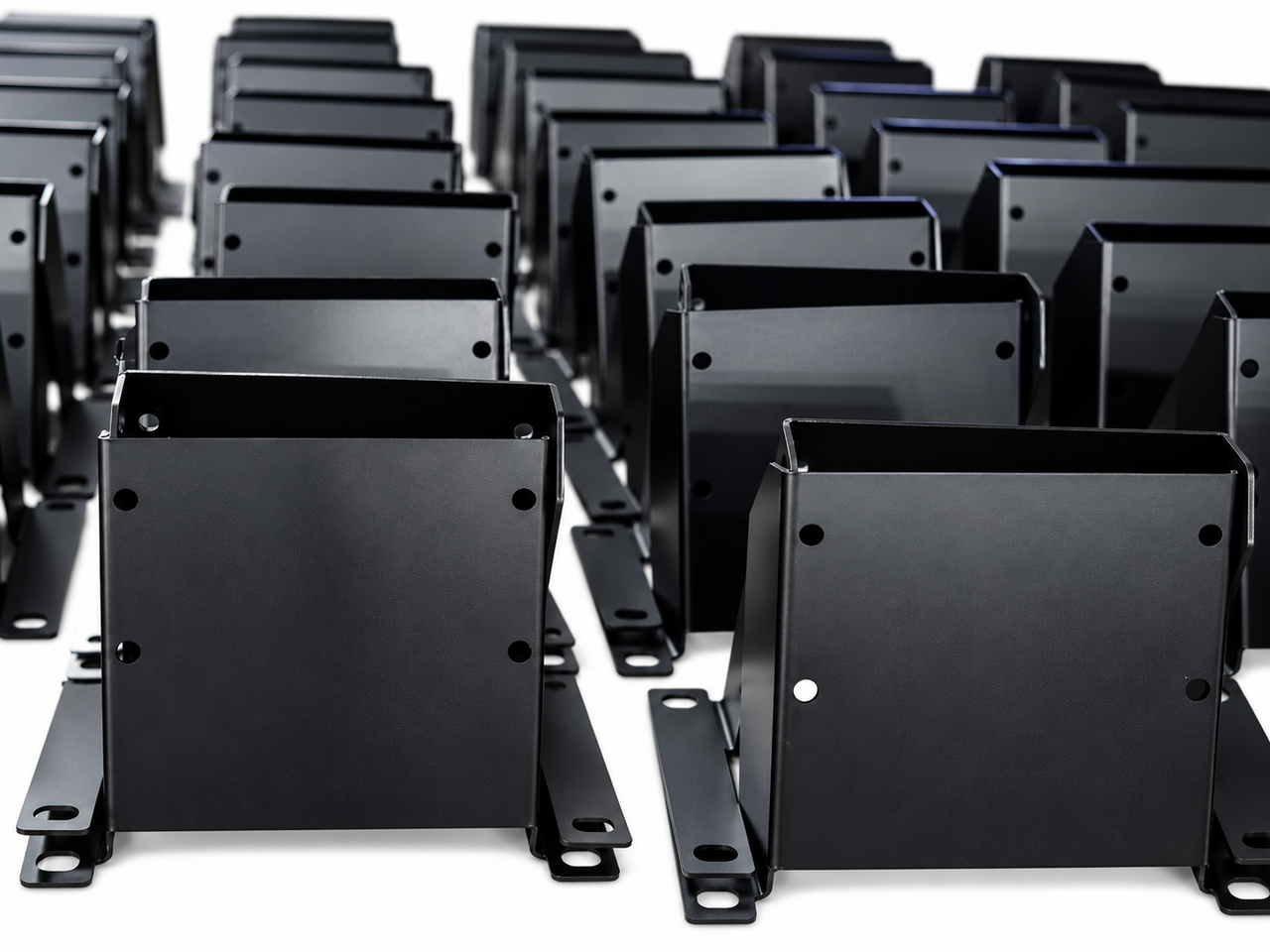 Rows of black formed metal mounting brackets