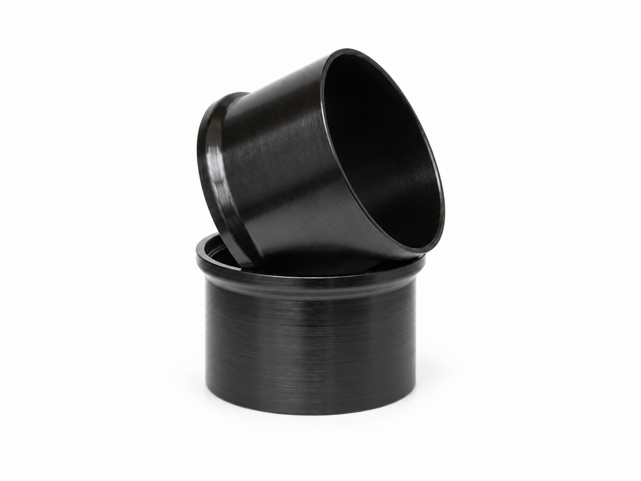 Two stacked black cylindrical metal sleeves